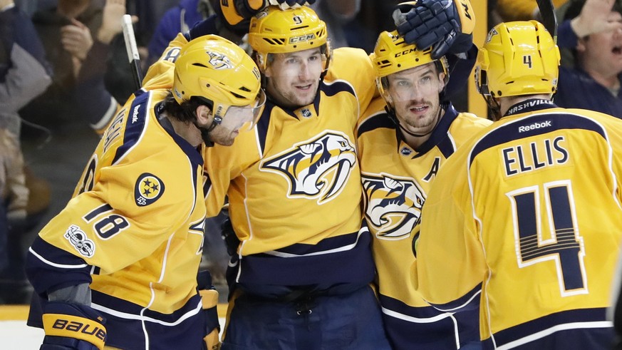 Nashville Predators left wing Filip Forsberg (9), of Sweden, celebrates with James Neal (18); Roman Josi, of Switzerland, second from right; and defenseman Ryan Ellis (4) after Forsberg scored his sec ...