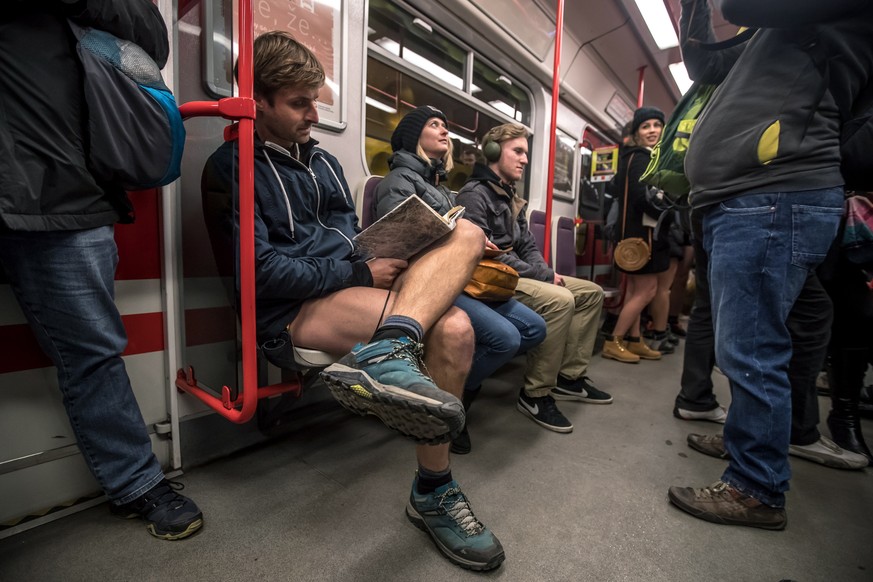 epa07280551 Young people wearing no pants participate in the &#039;No Pants Subway Ride&#039; in Prague, Czech Republic, 13 January 2019. No Pants Subway Ride is an annual global event started in New  ...