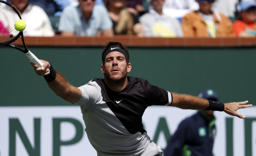 epa06613294 Juan Martin Del Potro from Argentina in action against Roger Federer from Switzerland in their finals match the BNP Paribas Open at the Indian Wells Tennis Garden in Indian Wells, Californ ...