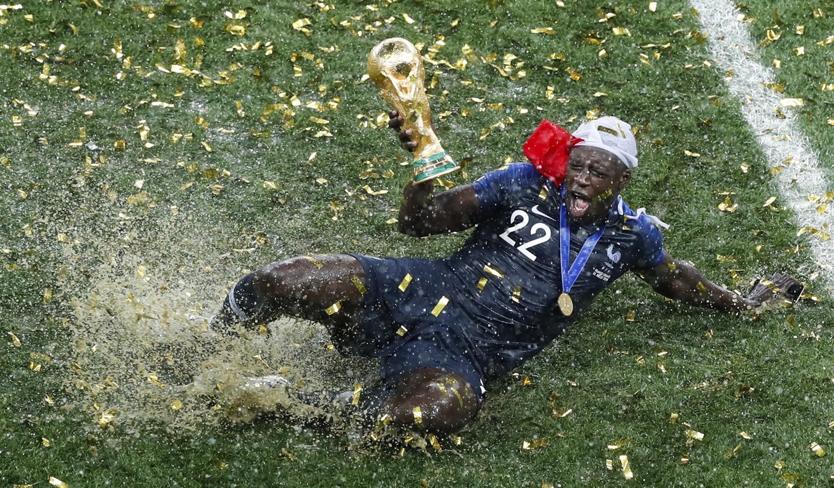 France's Benjamin Mendy celebrates with the trophy after his team won the final match against Croatia at the 2018 soccer World Cup in the Luzhniki Stadium in Moscow, Russia, on July 15, 2018. (AP ...