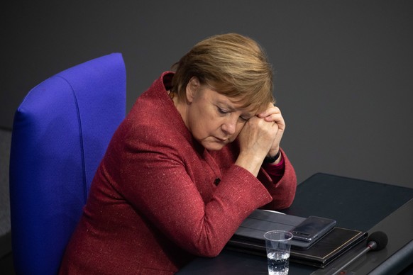 epa08871918 German Chancellor Angela Merkel during a session of the German parliament &#039;Bundestag&#039; in Berlin, Germany, 09 December 2020. Members of Bundestag debated in a general discussion o ...