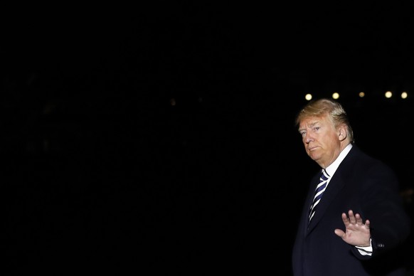 President Donald Trump waves as he walks across the South Lawn, Saturday, Oct. 20, 2018, returning to the White House in Washington after attending a rally in Nevada. (AP Photo/Jacquelyn Martin)