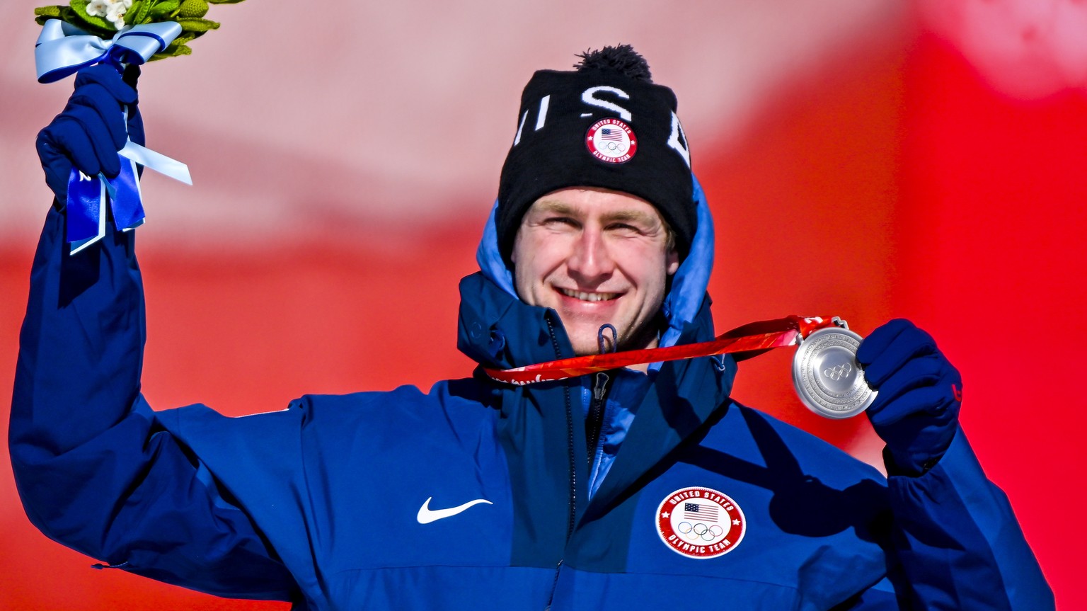 epa09737227 Silver medalist Ryan Cochran-Siegle of the United States during the medal ceremony for the Men&#039;s Super-G race of the Alpine Skiing events of the Beijing 2022 Olympic Games at the Yanq ...