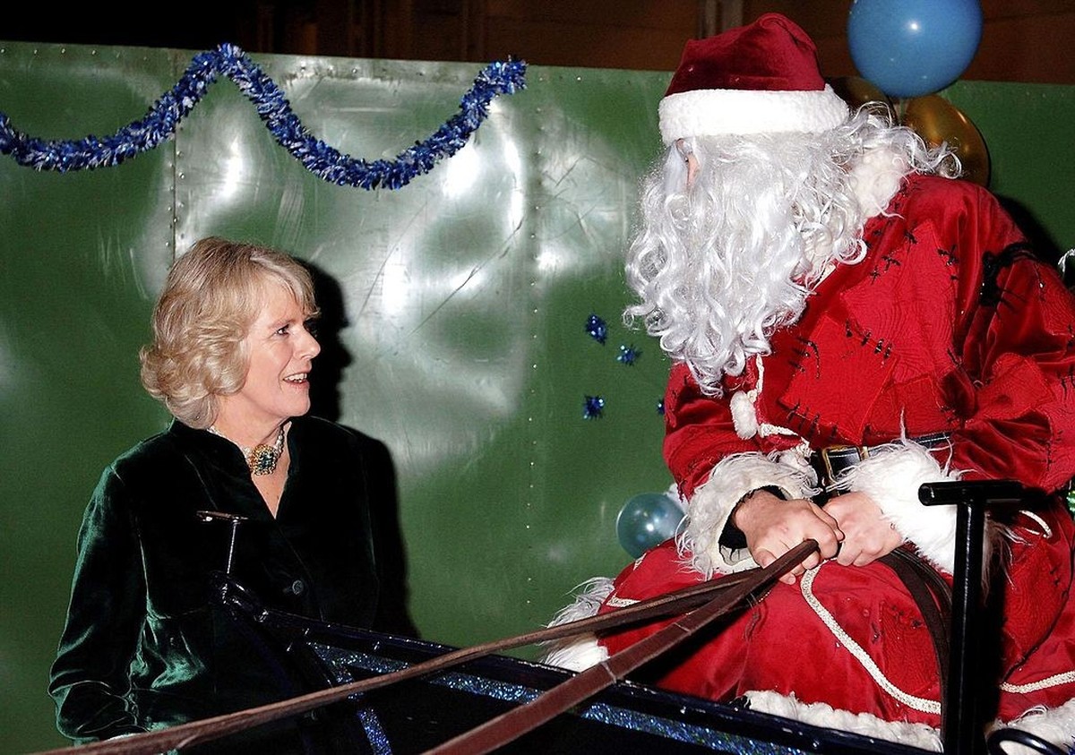 LONDON, ENGLAND - DECEMBER 18: (NO PUBLICATION IN UK MEDIA FOR 28 DAYS) Camilla, Duchess of Cornwall, patron of the British Equestrian Federation, talks to Father Christmas on a horse-drawn sleigh bac ...