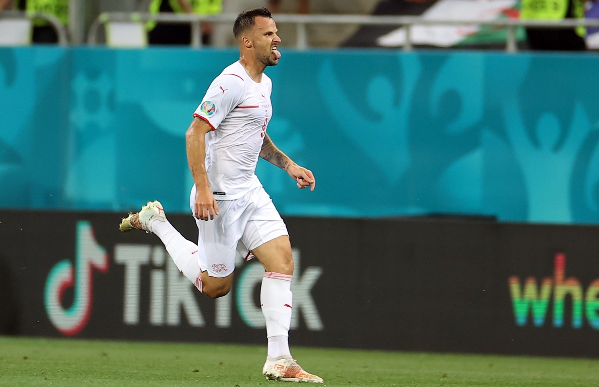 epa09309210 Haris Seferovic of Switzerland celebrates scoring the 1-0 during the UEFA EURO 2020 round of 16 soccer match between France and Switzerland in Bucharest, Romania, 28 June 2021. EPA/Marko D ...