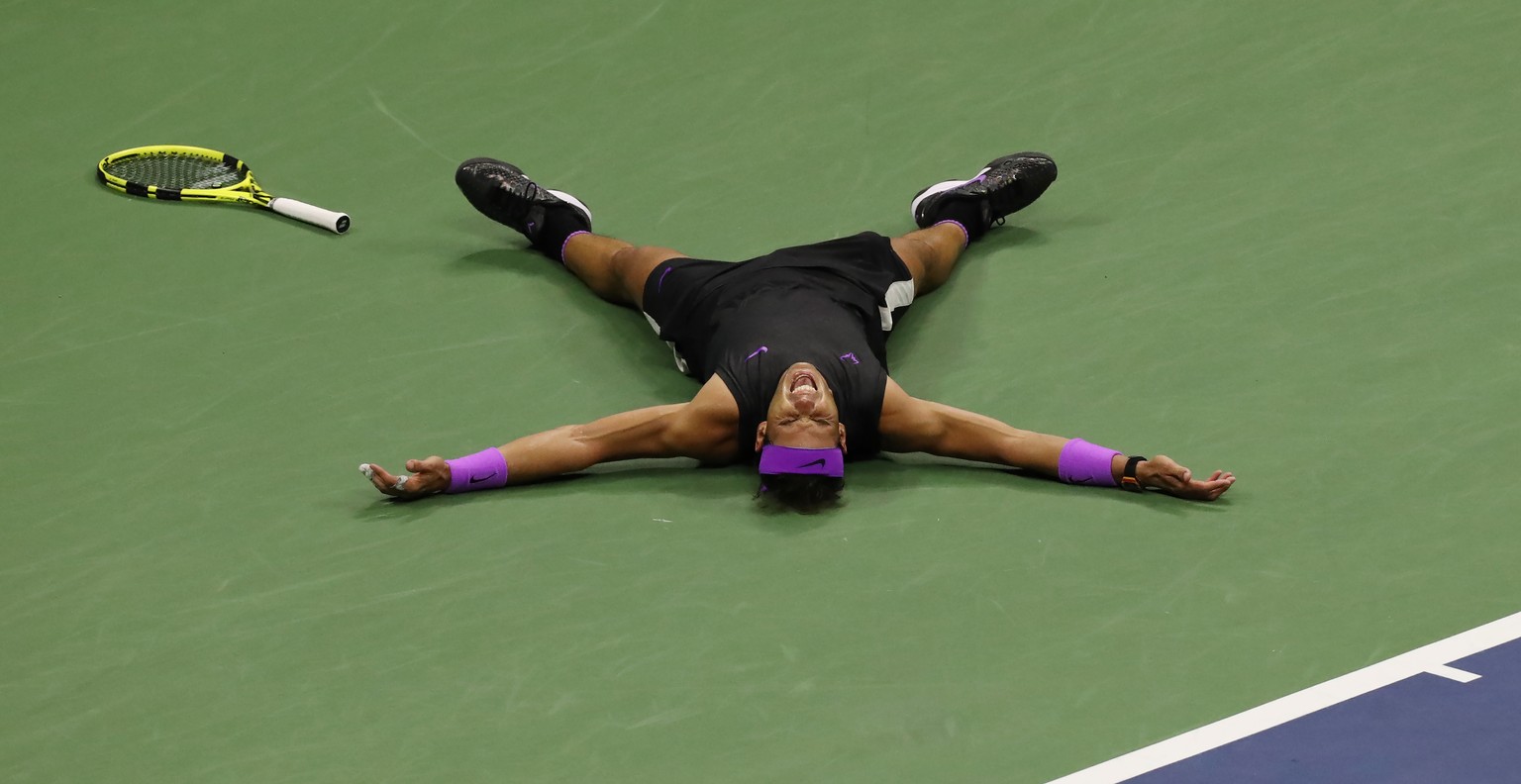 epa07829048 Rafael Nadal of Spain reacts after defeating Daniil Medvedev of Russia during the men&#039;s final match on the fourteenth day of the US Open Tennis Championships the USTA National Tennis  ...