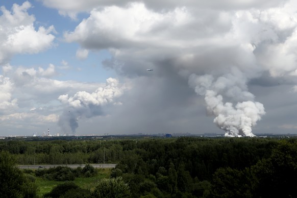 epa13130126 Smoke rises from fires at burning warehouses of the Russian internet store Wildberries in Shushary (R) and Utkina Zavod (L) in St. Petersburg, Russia, 24 July 2026. In the night of July 24 ...