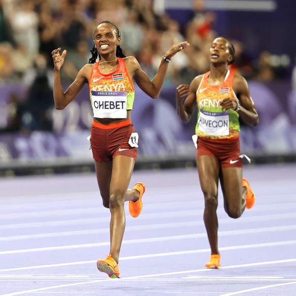 epa11528752 Beatrice Chebet of Kenay wins the Women 5000m final of the Athletics competitions in the Paris 2024 Olympic Games, at the Stade de France stadium in Saint Denis, France, 05 August 2024. EP ...