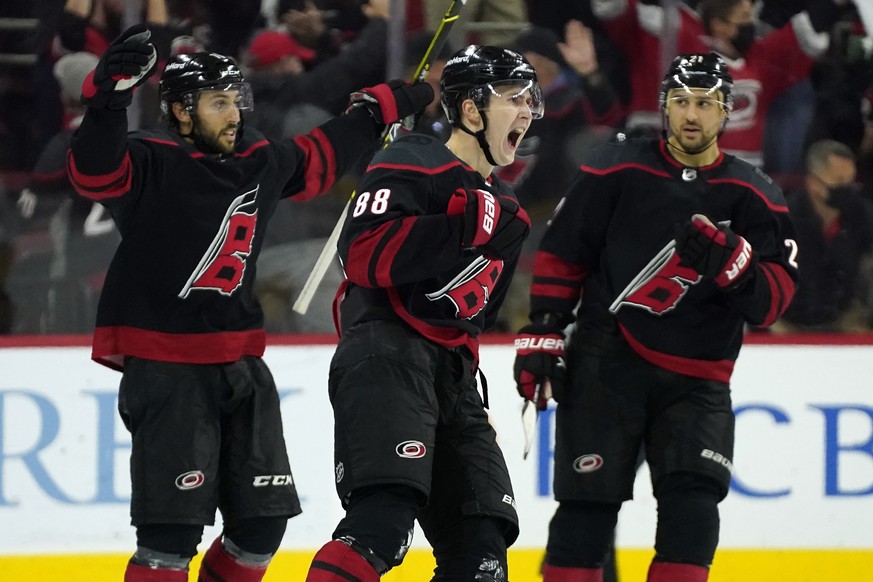 Carolina Hurricanes center Martin Necas (88) celebrates his goal against the Nashville Predators with center Vincent Trocheck, lefdt, and right wing Nino Niederreiter (21) during the third period in G ...