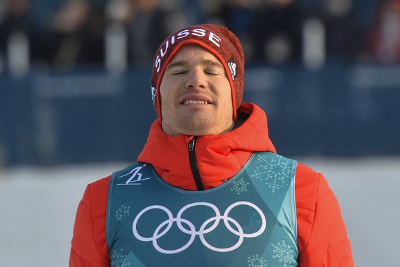 Winner Dario Cologna of Switzerland looks on after the men Cross-Country Skiing 15 km free race in the Alpensia Biathlon Center during the XXIII Winter Olympics 2018 in Pyeongchang, South Korea, on Fr ...