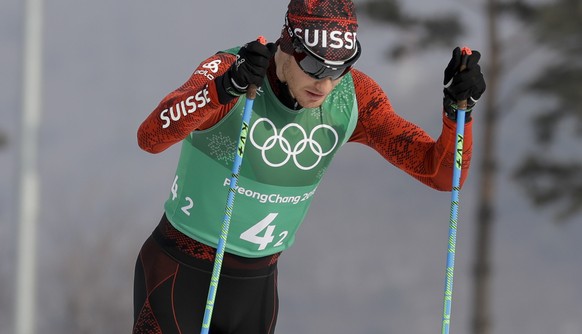 Dario Cologna, of Switzerland, competes during the men&#039;s 4 x 10km relay cross-country skiing competition at the 2018 Winter Olympics in Pyeongchang, South Korea, Sunday, Feb. 18, 2018. (AP Photo/ ...