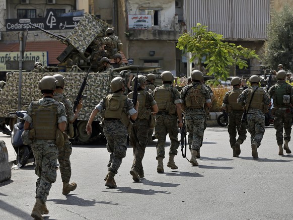 Lebanese army soldiers deploy during a protest in Beirut, Lebanon, Thursday, Oct. 14, 2021. Armed clashes broke out in Beirut Thursday during the protest against the lead judge investigating last year ...