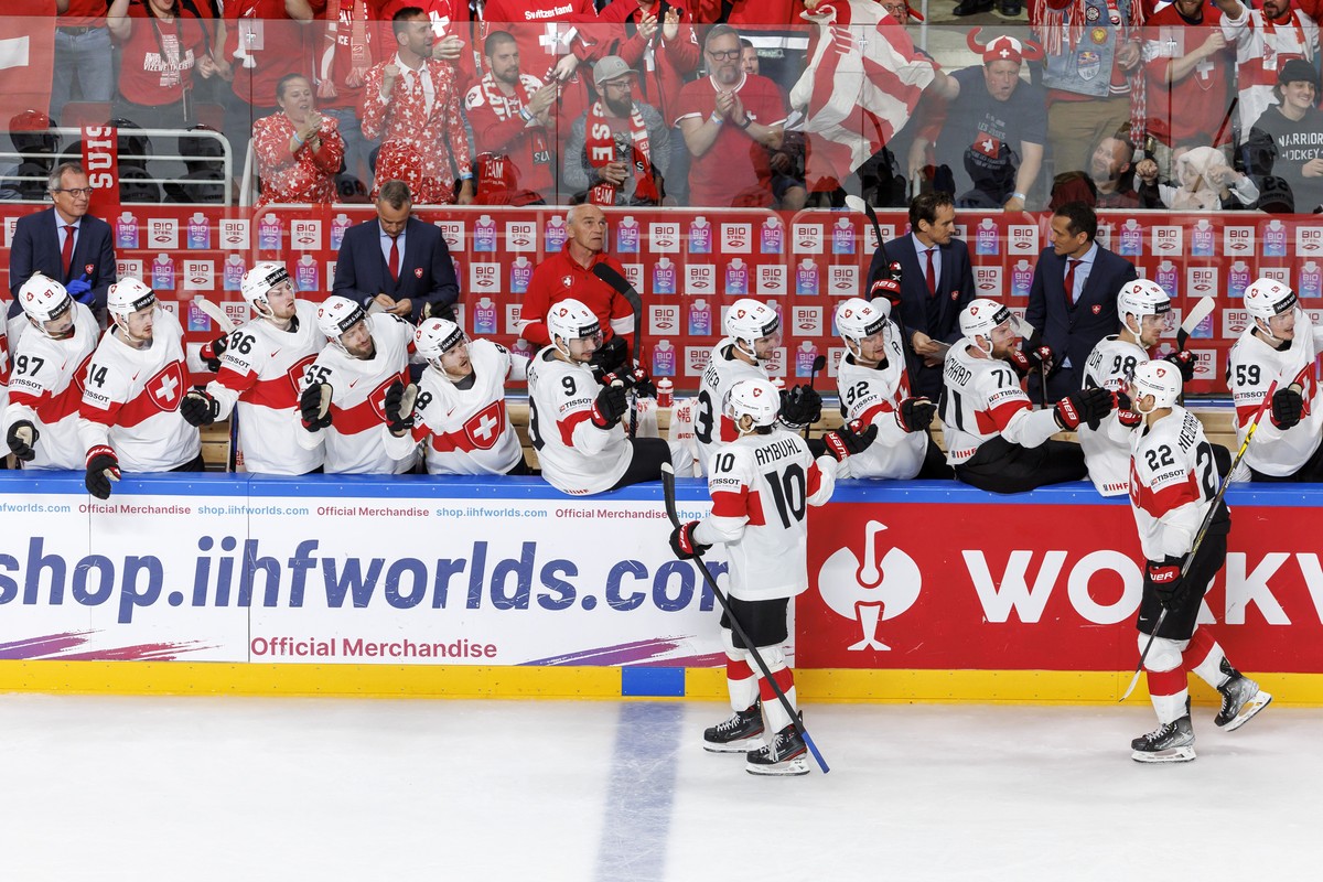 Switzerland's forward Andres Ambuehl #10 and Switzerland's forward Nino Niederreiter #22, celebrate the Ambuehl's goal with their teammates after scoring the 1:3, during the IIHF 2023 W ...