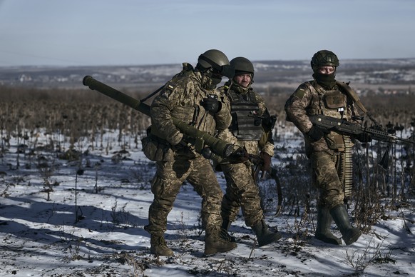 FILE - Ukrainian soldiers on their positions in the frontline near Soledar, Donetsk region, Ukraine, on Jan. 11, 2023. Russia's Defense Ministry said Friday Jan. 13, 2023 that its forces have captured ...
