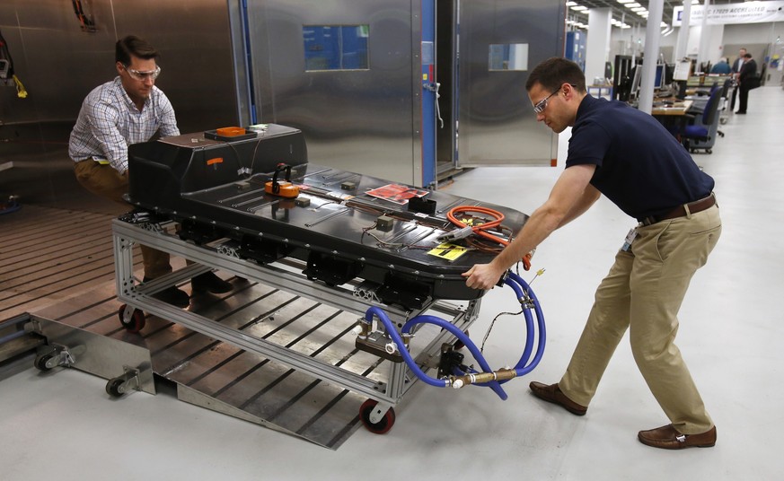 FILE- In this Nov. 4, 2016, file photo, a Chevrolet Bolt EV battery pack is removed for testing after undergoing charging and discharging cycles at General Motors Warren Technical Center&#039;s Advanc ...