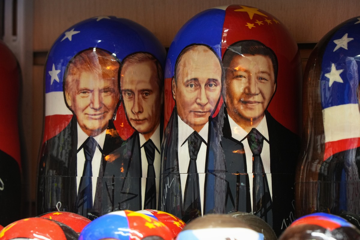 Matryoshkas, the traditional Russian wooden dolls, with images of U.S. President Donald Trump, Russian President Vladimir Putin and China's President Xi Jinping are displayed for sale at a souven ...