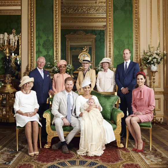 This is the official christening photo released by the Duke and Duchess of Sussex on Saturday, July 6, 2019, showing Britain's Prince Harry, front row, second left and Meghan, the Duchess of Suss ...