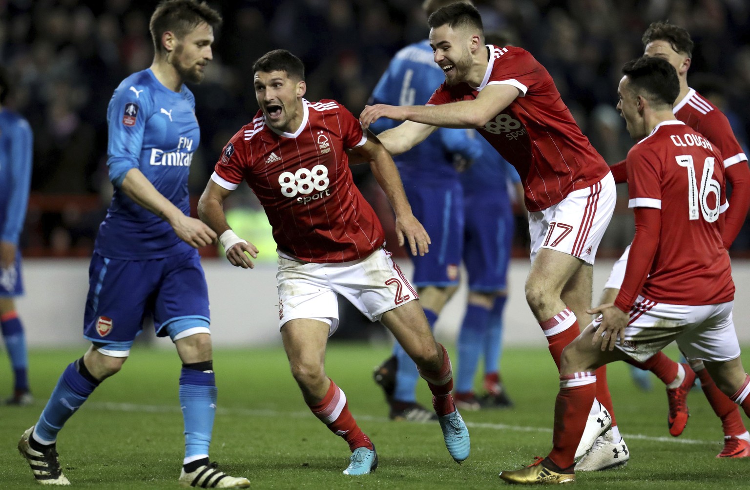 Nottingham Forest&#039;s Eric Lichaj, center, celebrates scoring his side&#039;s second goal of the game during the English FA Cup, Third Round soccer match between Nottingham Forest and Arsenal at th ...