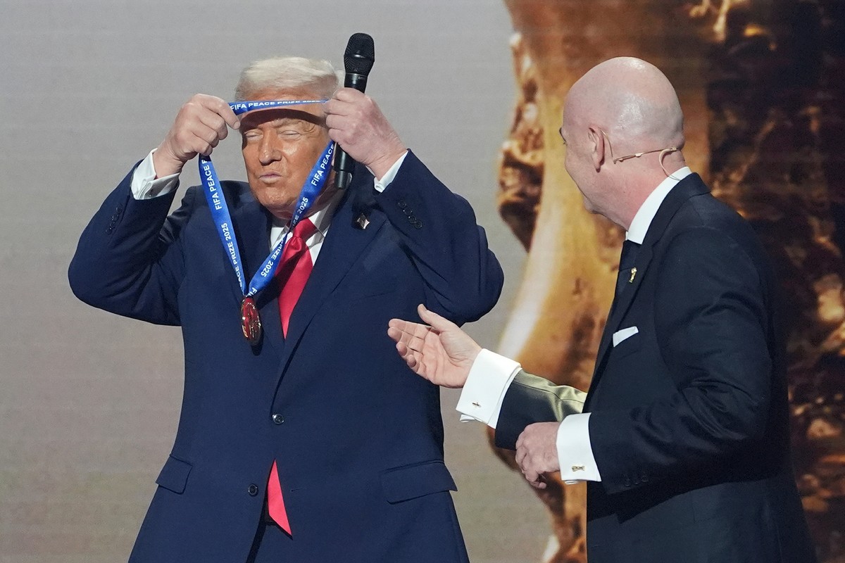 FILE - President Donald Trump is presented with the inaugural FIFA Peace Prize by FIFA President Gianni Infantino during the 2026 FIFA World Cup draw at the Kennedy Center, Dec. 5, 2025, in Washington ...
