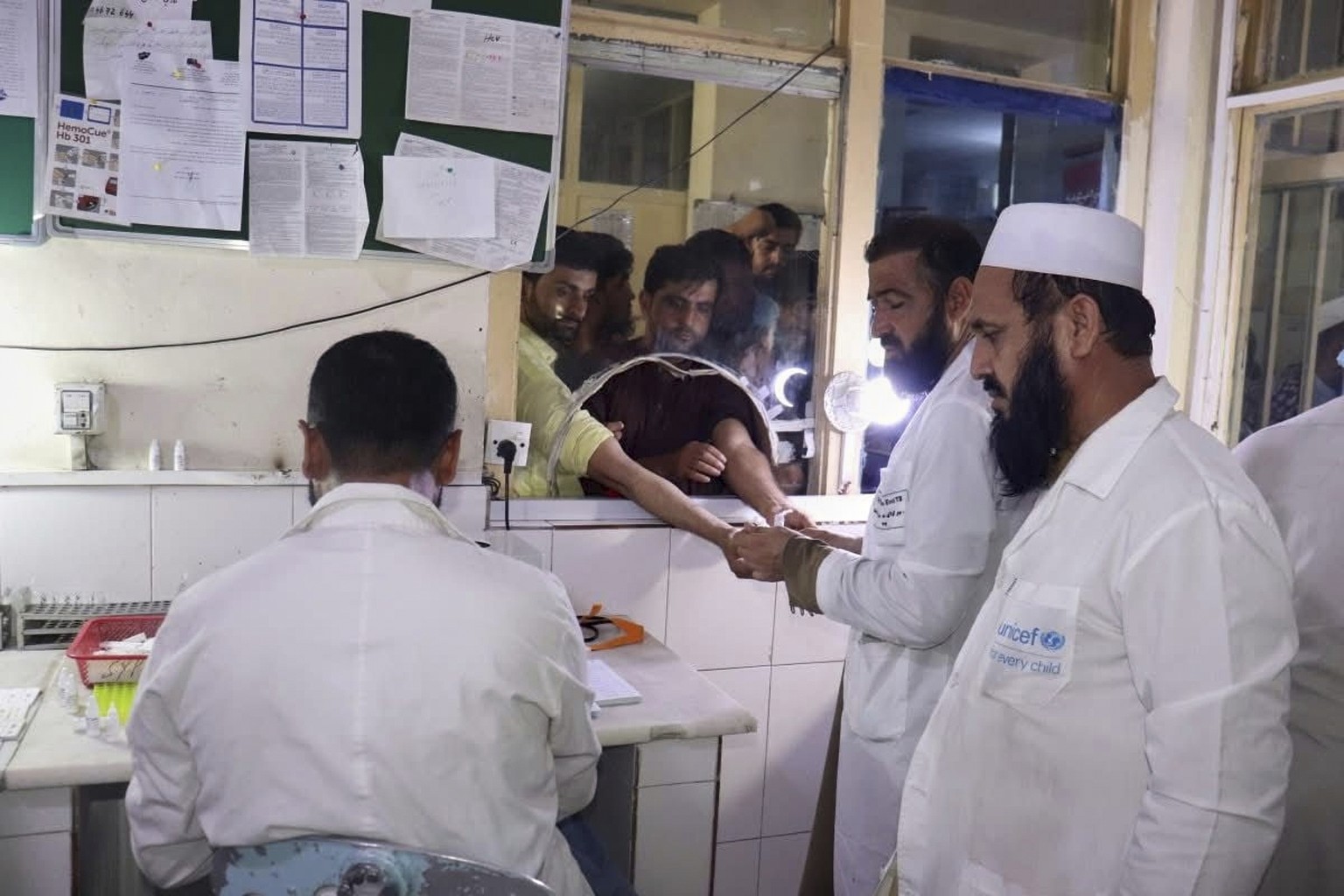In this photo released by the Ministry of Public Health, Afghans donate blood for victims of an earthquake that killed hundreds and destroyed numerous villages in eastern Afghanistan, at Nangarhar Reg ...