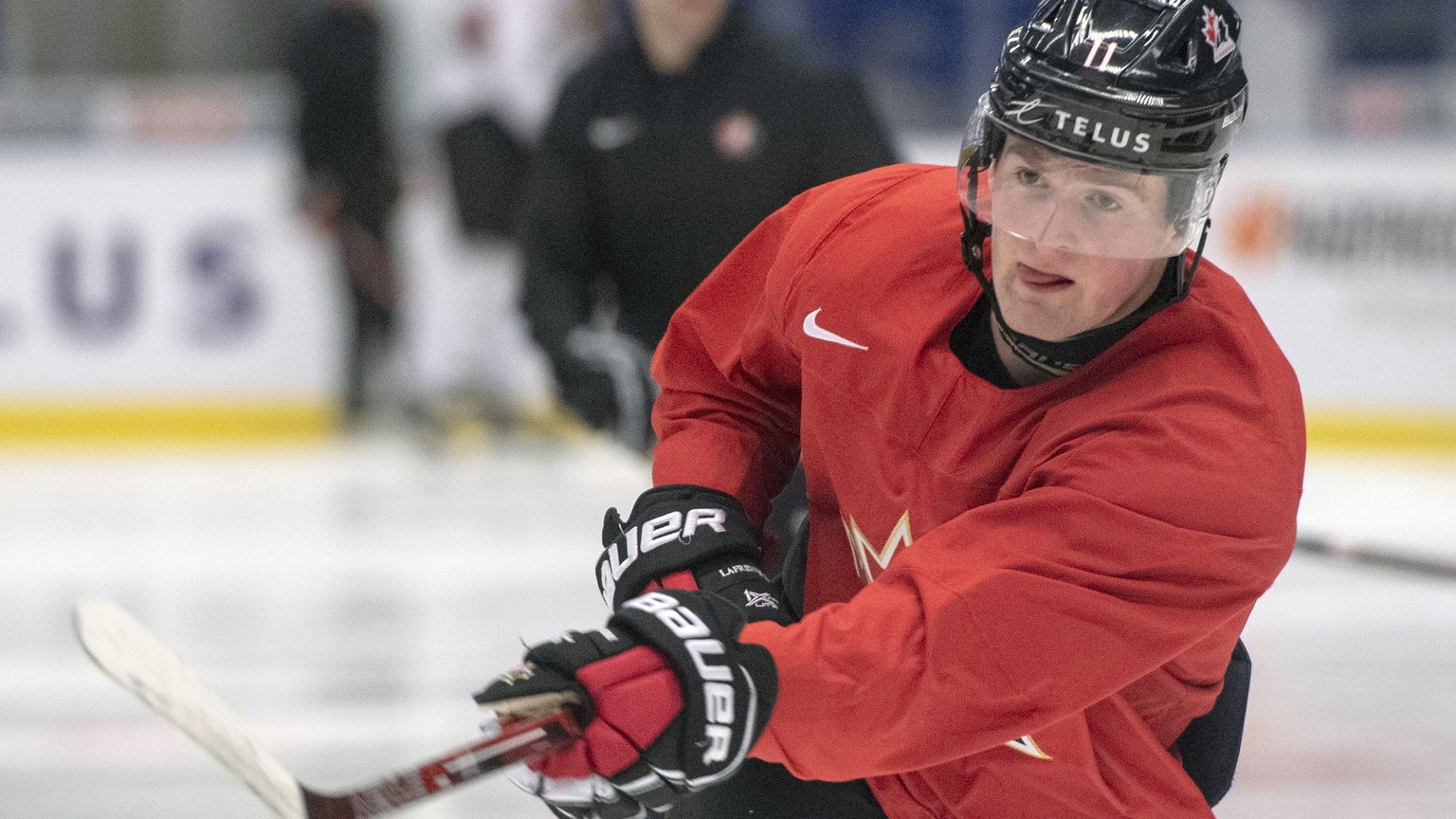 FILE - In this Jan. 1, 2020, file photo, Canada&#039;s Alexis Lafreniere shoots during the team&#039;s practice at the World Junior Hockey Championships in Ostrava, Czech Republic. LafreniÃ ?re has no ...