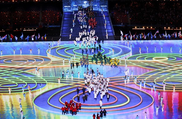 epa09774051 Athletes enter the stadium during the Closing Ceremony for the Beijing 2022 Olympic Games at the National Stadium, also known as Bird's Nest, in Beijing China, 20 February 2022. EPA/H ...