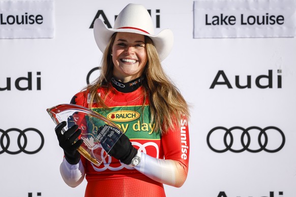 Switzerland&#039;s Corinne Suter celebrates her victory on the podium following the women&#039;s World Cup super-G ski race in Lake Louise, Alberta, on Sunday Dec. 4, 2022. (/Jeff McIntosh/The Canadia ...