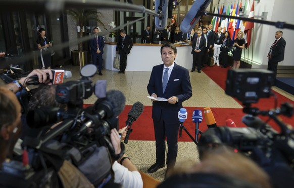 epa06849053 Italian Prime Minister Giseppe Conte speaks at the end of a night of negotiation on migration during an European Council summit in Brussels, Belgium, 29 June 2018. EU countries&#039; leade ...