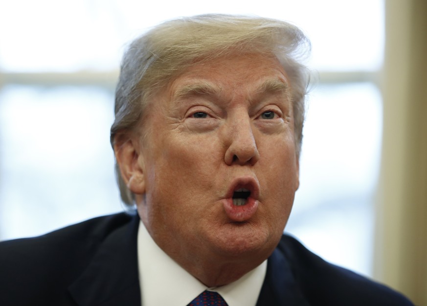 President Donald Trump speaks to media as he signs Section 201 actions in the Oval Office of the White House in Washington, Tuesday, Jan. 23, 2018. Trump says he is imposing new tariffs to &quot;prote ...