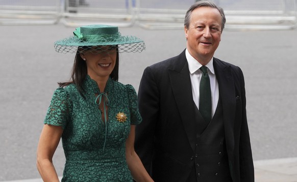 Former Britain&#039;s Prime Minister David Cameron and his wife Samantha arrive to attend a Service of Thanksgiving at Westminster Abbey on V-E Day in London, Thursday, May 8, 2025.(AP Photo/Kirsty Wi ...