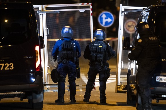 Riot police wait for the fans of Belgrade marching towards the stadium, ahead of the Uefa Champions League soccer match between BSC Young Boys and Crvena Zvezda (Red Star Belgrade) near the train stat ...