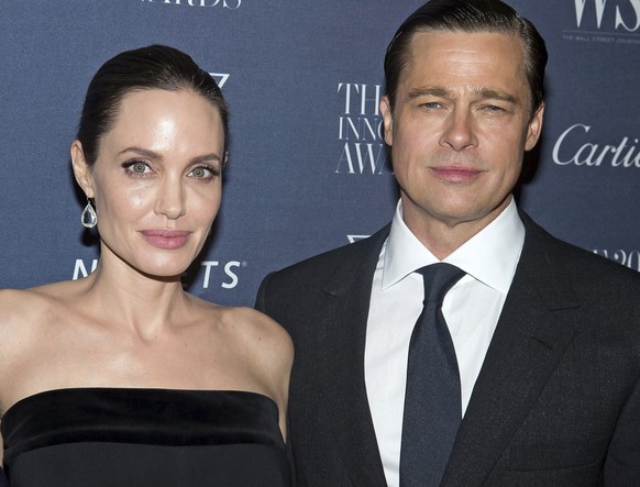 FILE - In this Nov. 4, 2015, file photo Angelina Jolie Pitt and Brad Pitt pose for a photo at the WSJ Magazine Innovator Awards 2015 at The Museum of Modern Art in New York. Jolie criticized a judge d ...