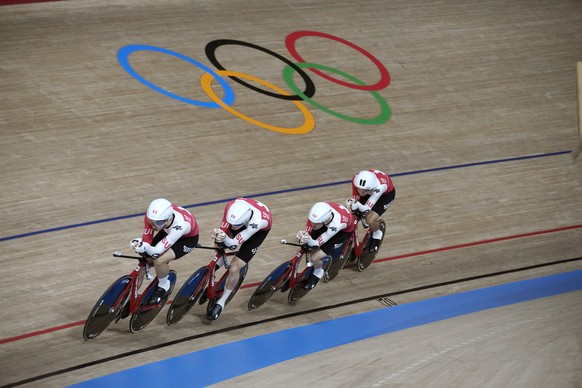 Team Switzerland competes during the track cycling men&#039;s team pursuit at the 2020 Summer Olympics, Monday, Aug. 2, 2021, in Izu, Japan. (AP Photo/Christophe Ena)