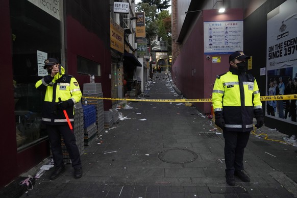 FILE- Police officers stand guard at the scene where dozens of people died and were injured during a crowd surge in Seoul, South Korea, on Oct. 30, 2022. South Korean police on Friday, Jan. 13, 2023,  ...