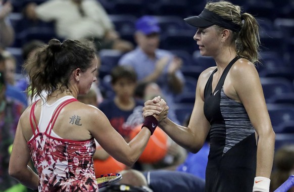 Patty Schnyder, left, of Switzerland, and Maria Sharapova, of Russia, shake hands after Sharapova won their first round match at the U.S. Open tennis tournament, Tuesday, Aug. 28, 2018, in New York. ( ...