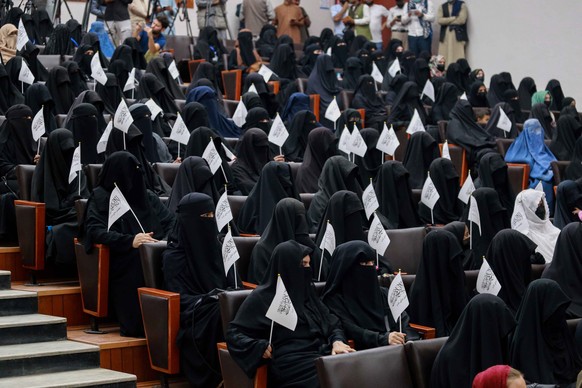 epa09460808 Afghan students listen to women speakers prior to their pro-Taliban rally outside the Shaheed Rabbani Education University in Kabul, Afghanistan, 11 September 2021. The United States envoy ...