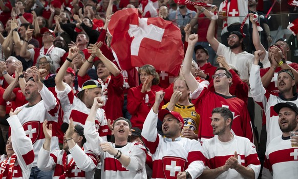 KEYPIX - Swiss fans celebrate during the 2026 IIHF Men's Ice Hockey World Championship preliminary round group A game between Switzerland and Finland, at the Swiss Life Arena ice hockey stadium,  ...