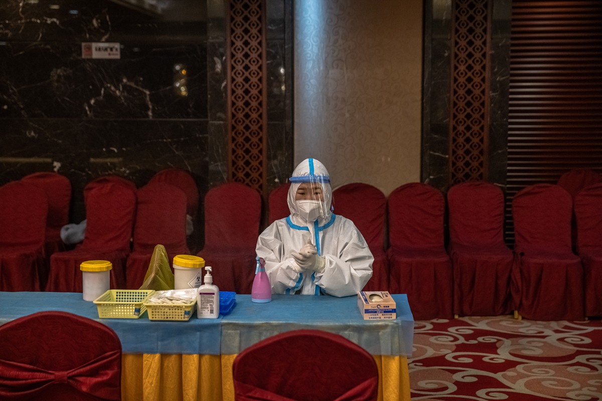 epa09050323 A medical worker waits to carry out COVID-19 tests ahead of the the opening session of the Chinese People's Political Consultative Conference (CPPCC), in a hotel, in Beijing, China, 0 ...