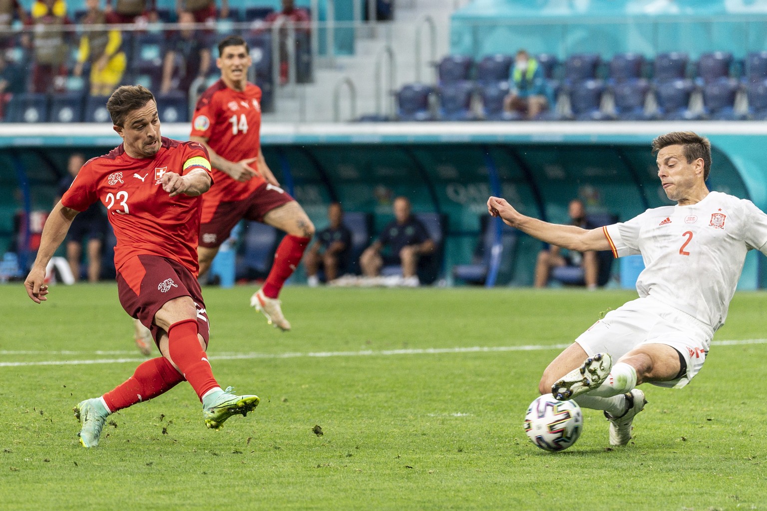 epa09318474 Switzerland&#039;s forward Xherdan Shaqiri (L) scores the 1-1 equalizer against Spain&#039;s defender Cesar Azpilicueta during the UEFA EURO 2020 quarter final match between Switzerland an ...