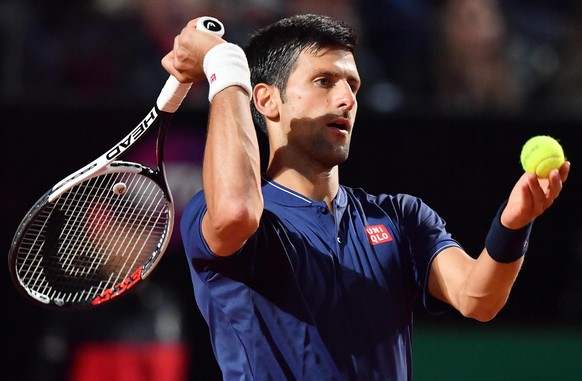 epa05977601 Novak Djokovic of Serbia reacts during his semi final match against Dominic Thiem of Austria in the Italian Open tennis tournament at the Foro Italico in Rome, Italy, 20 May 2017. EPA/ETTO ...