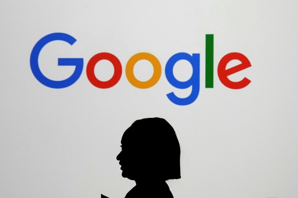 FILE - A woman walks by a giant screen with a logo at an event at the Paris Google Lab on the sidelines of the AI Action Summit in Paris, on Feb. 9, 2025. (AP Photo/Thibault Camus,File)
South Korea Go ...