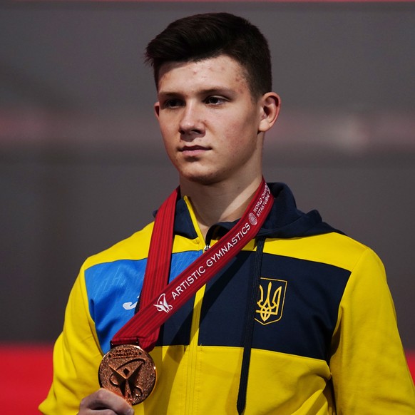 epa09538923 Bronze medalist Illia Kovtun of Ukraine hold his medal at an award ceremony for the Men&#039;s All-Around Final at the 50th FIG Artistic Gymnastics World Championships in Kitakyushu, Japan ...