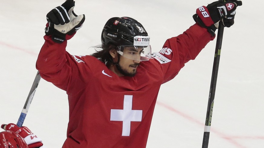 Switzerlands Eric Blum reacts after scoring victory goal during the overtime action of the Ice Hockey World Championships Group A match between Switzerland and Denmark, in Moscow, Russia, on Tuesday, ...