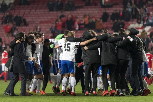 Basel&#039;s players cheer after winning the UEFA Champions League Group stage Group A matchday 6 soccer match between Portugal&#039;s SL Benfica and Switzerland&#039;s FC Basel 1893 in Benfica&#039;s ...