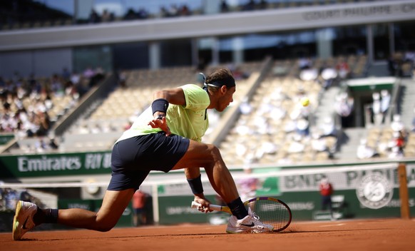 epa09257843 Rafael Nadal of Spain in action against Diego Schwartzman of Argentina during their quarter final match at the French Open tennis tournament at Roland Garros in Paris, France, 09 June 2021 ...