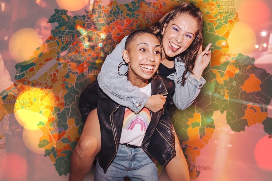 Playful young woman piggybacking her best friend outdoors at night. Happy young women having fun while going out with their friends in the city. Vibrant friends spending their weekend together.