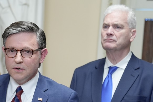 Speaker of the House Mike Johnson, R-La., left, speaks as House Majority Whip Tom Emmer, R-Minn., right, listens during a news conference on Capitol Hill, Friday, March 27, 2026, in Washington. (AP Ph ...