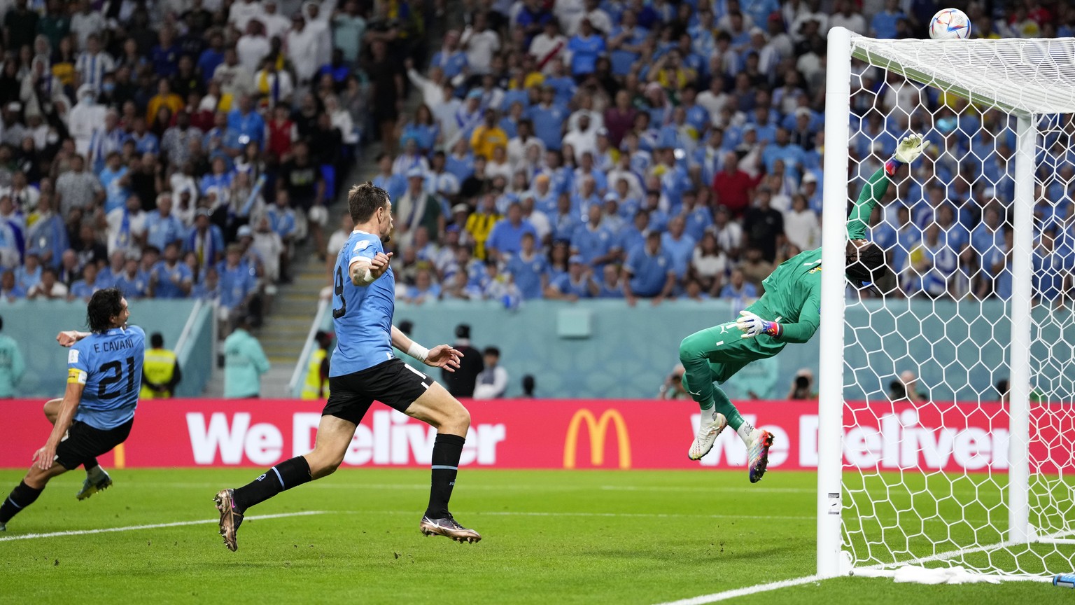 Ghana&#039;s goalkeeper Lawrence Ati-Zigi saves a ball from Uruguay&#039;s Edinson Cavani during the World Cup group H soccer match between Ghana and Uruguay, at the Al Janoub Stadium in Al Wakrah, Qa ...