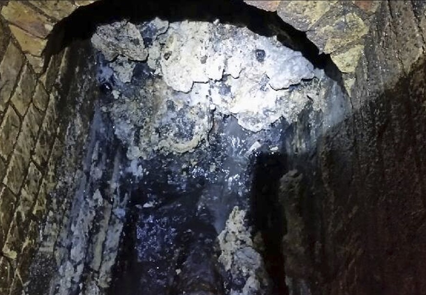 In this undated handout photo issued by Thames Water on Tuesday, Sept. 12, 2017, a view of a fatberg inside a sewer in Whitechapel, London. British engineers say they have launched a “sewer war” again ...