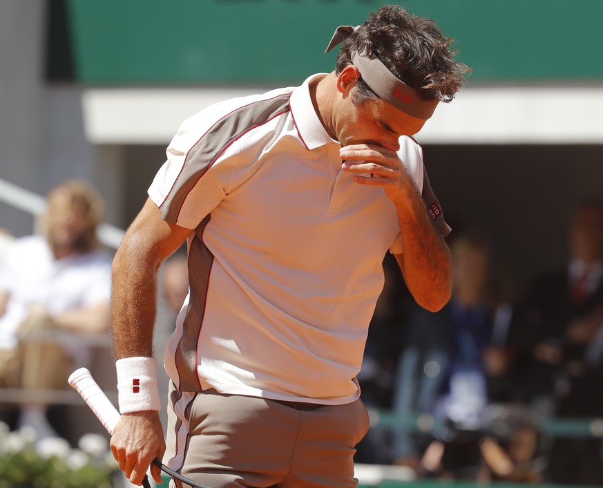 Switzerland&#039;s Roger Federer reacts after missing a shot against Spain&#039;s Rafael Nadal during their semifinal match of the French Open tennis tournament at the Roland Garros stadium in Paris,  ...